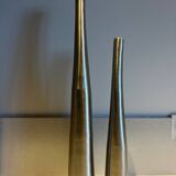 Dyptic vase in brushed chrome metal for single flowers.