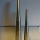 Dyptic vase in brushed chrome metal for single flowers.