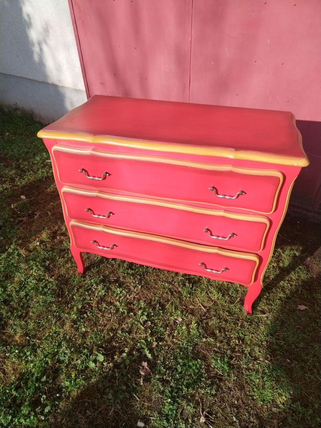 Matte gold and red patinated chest of drawers