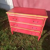 Matte gold and red patinated chest of drawers