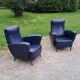 Paire de fauteuils des années 50 pieds compas recouverts de skaï bleu marine
