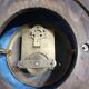 Wall clock in glazed earthenware decoration and brass chain empire style
