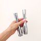 Pair of minimalist aluminium candlesticks in the style of Erika Pekkar.