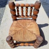 Low chair 50s oak and straw by the fire