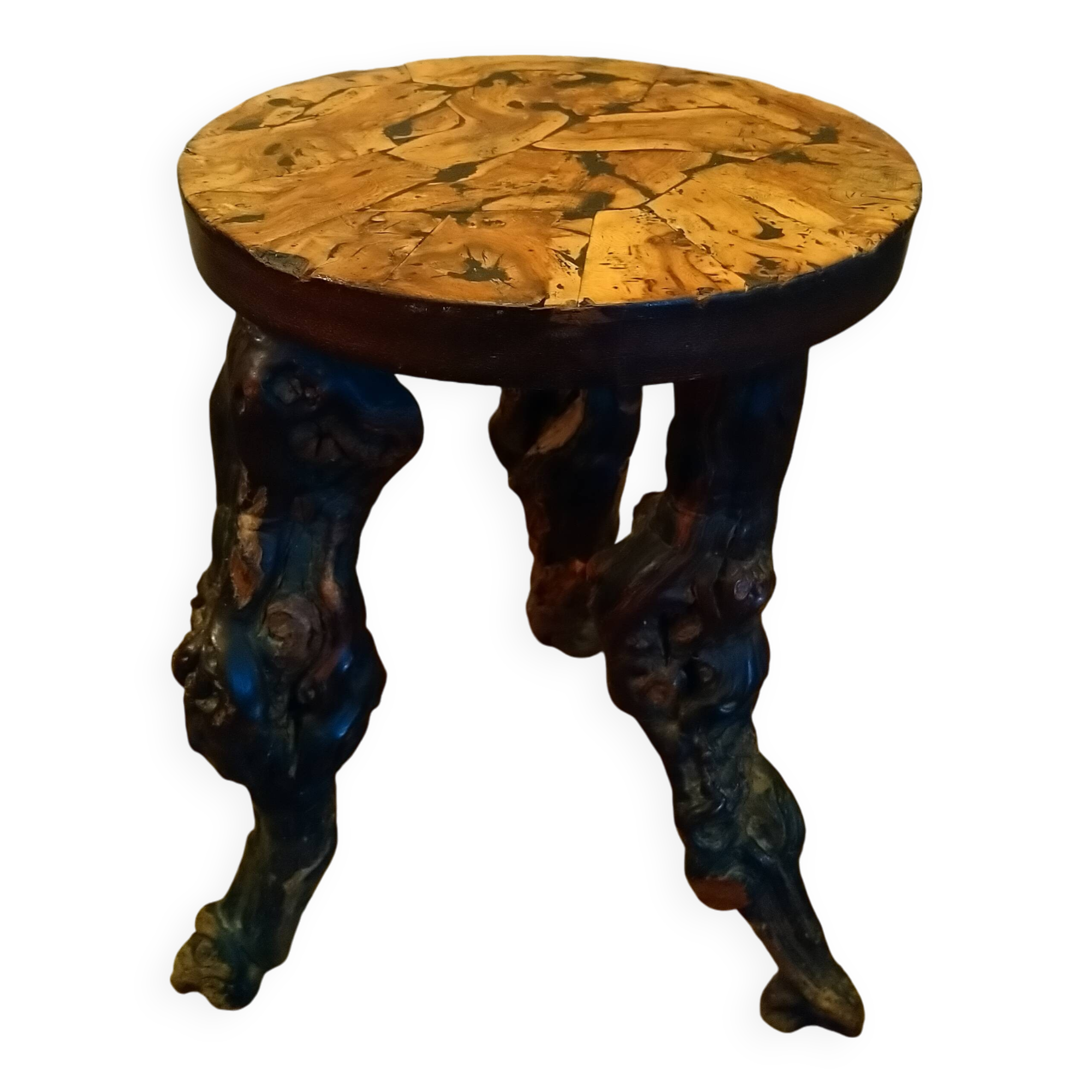 Brutalist tripod stool made from vine stumps.