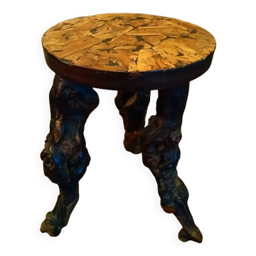 Brutalist tripod stool made from vine stock.