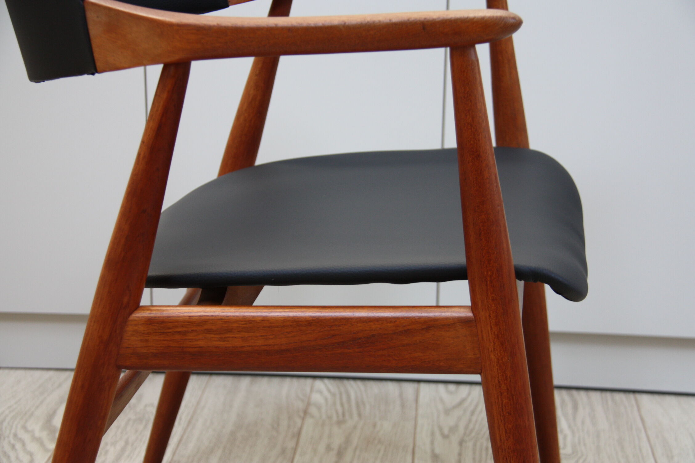 Vintage armchair in teak and black leather model Casina 60s