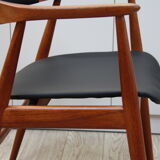 Vintage armchair in teak and black leather model Casina 60s