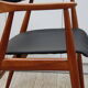 Vintage armchair in teak and black leather model Casina 60s