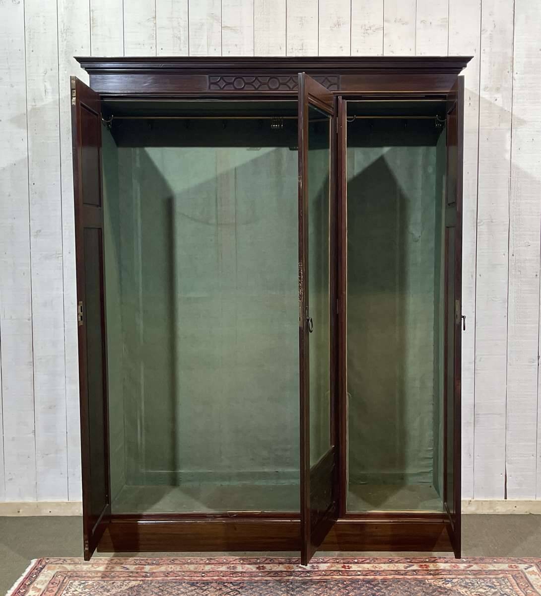 19th-century English mahogany three-door wardrobe.