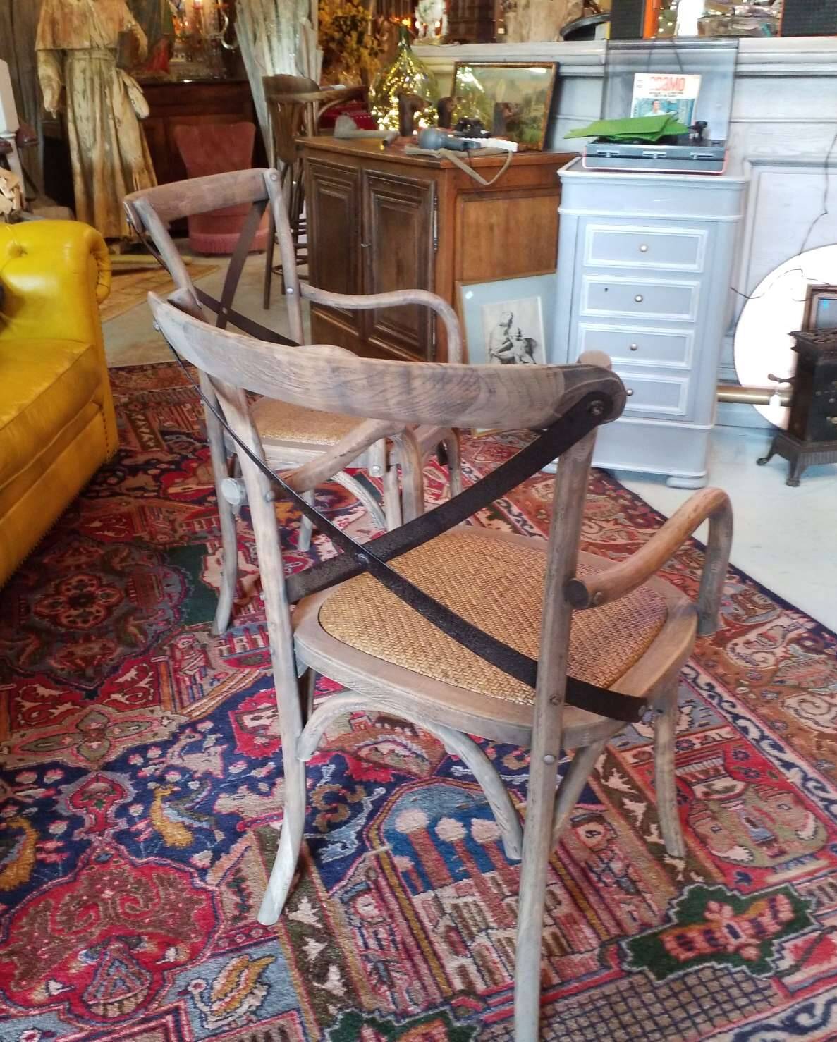 Angled wooden armchairs