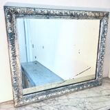 Old mercury mirror, in carved wood with silver leaf.