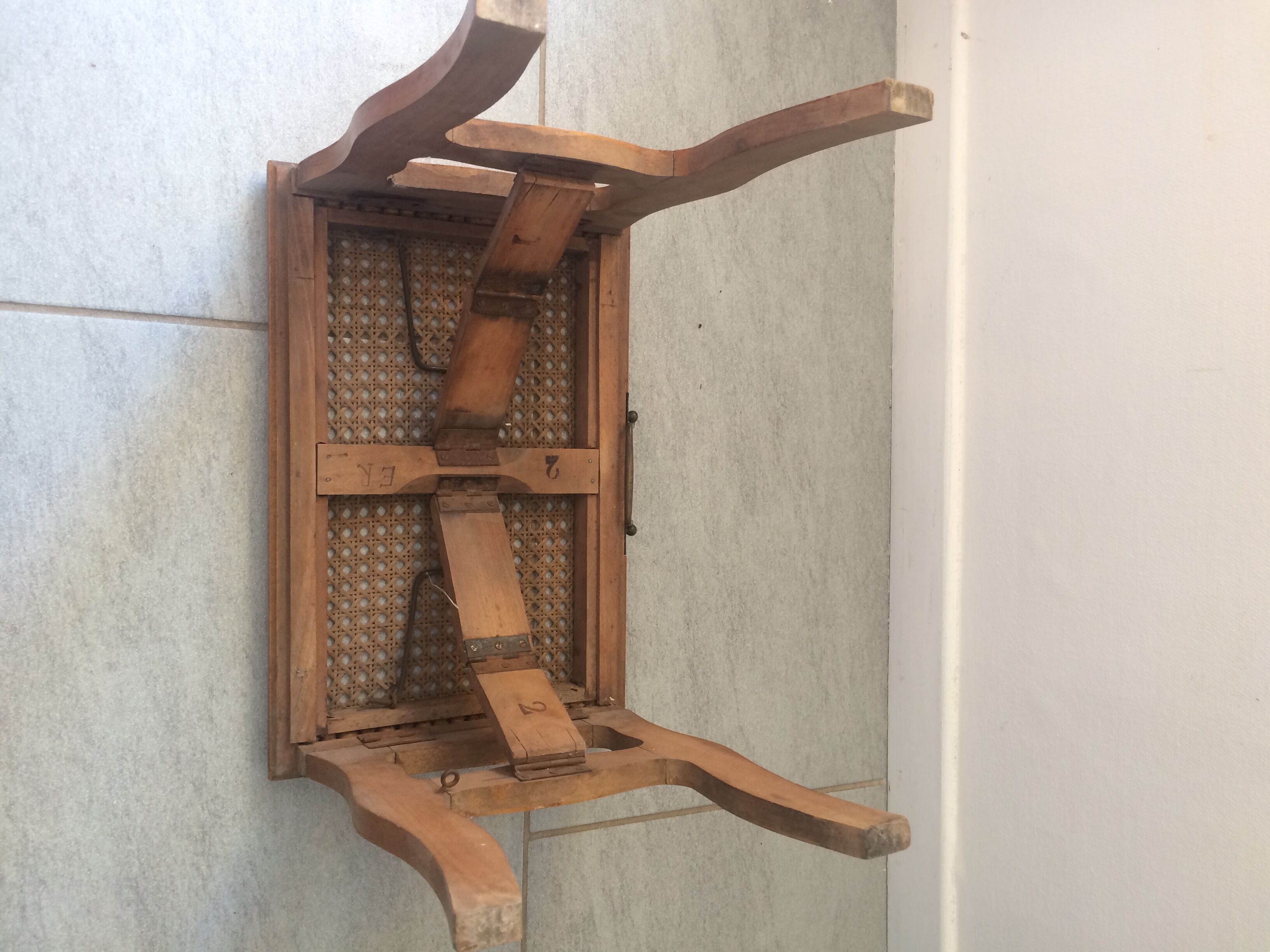 Folding stool in old caning