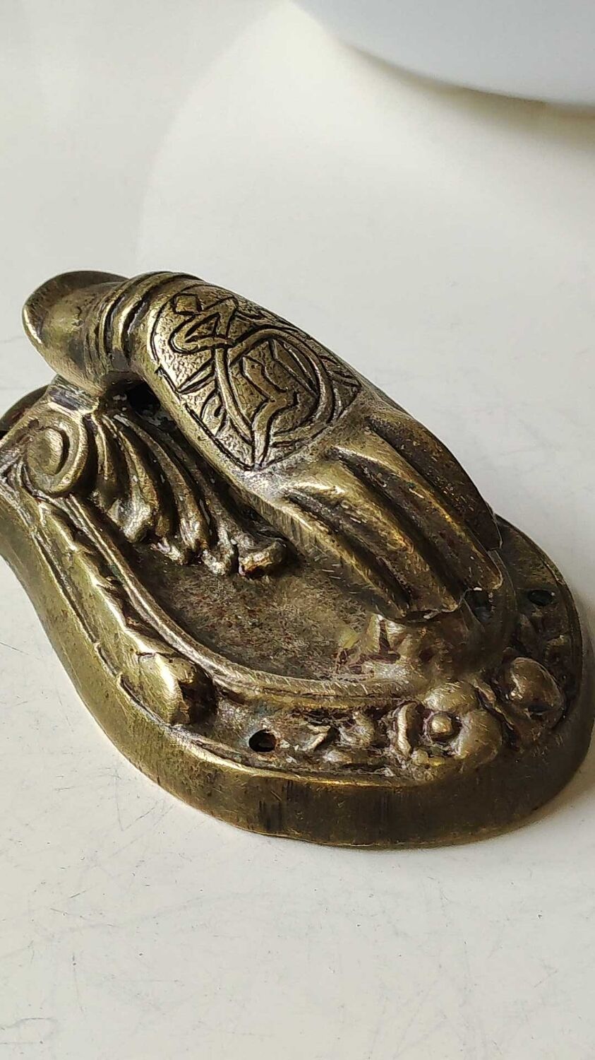 Door knocker in bronze