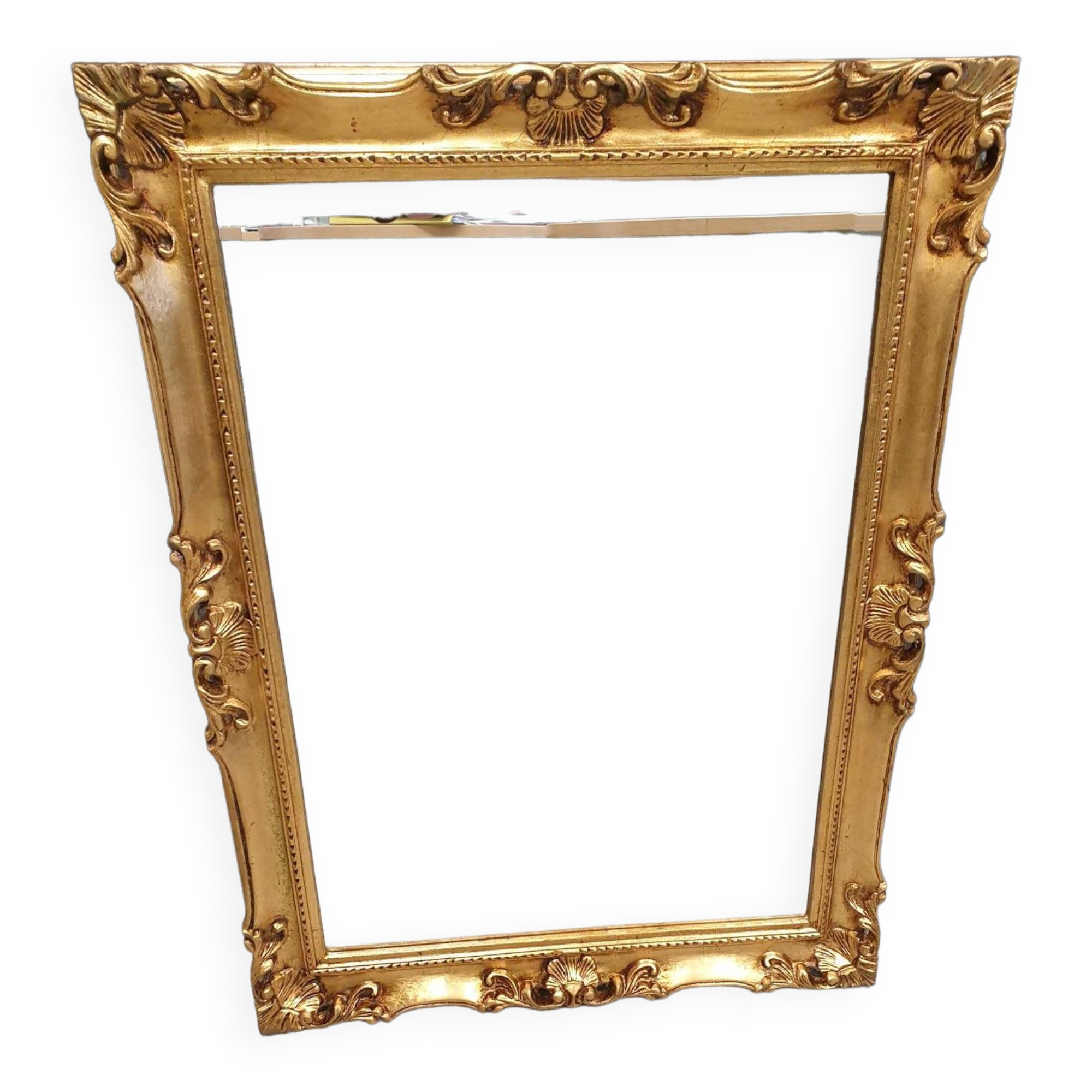 Beveled mirror and golden wood