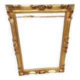 Beveled mirror and golden wood