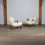 Early pair of arnold madsen clam chairs in curly sheepskin, madsen & schubell, 1944
