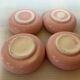 Four double pink candlesticks