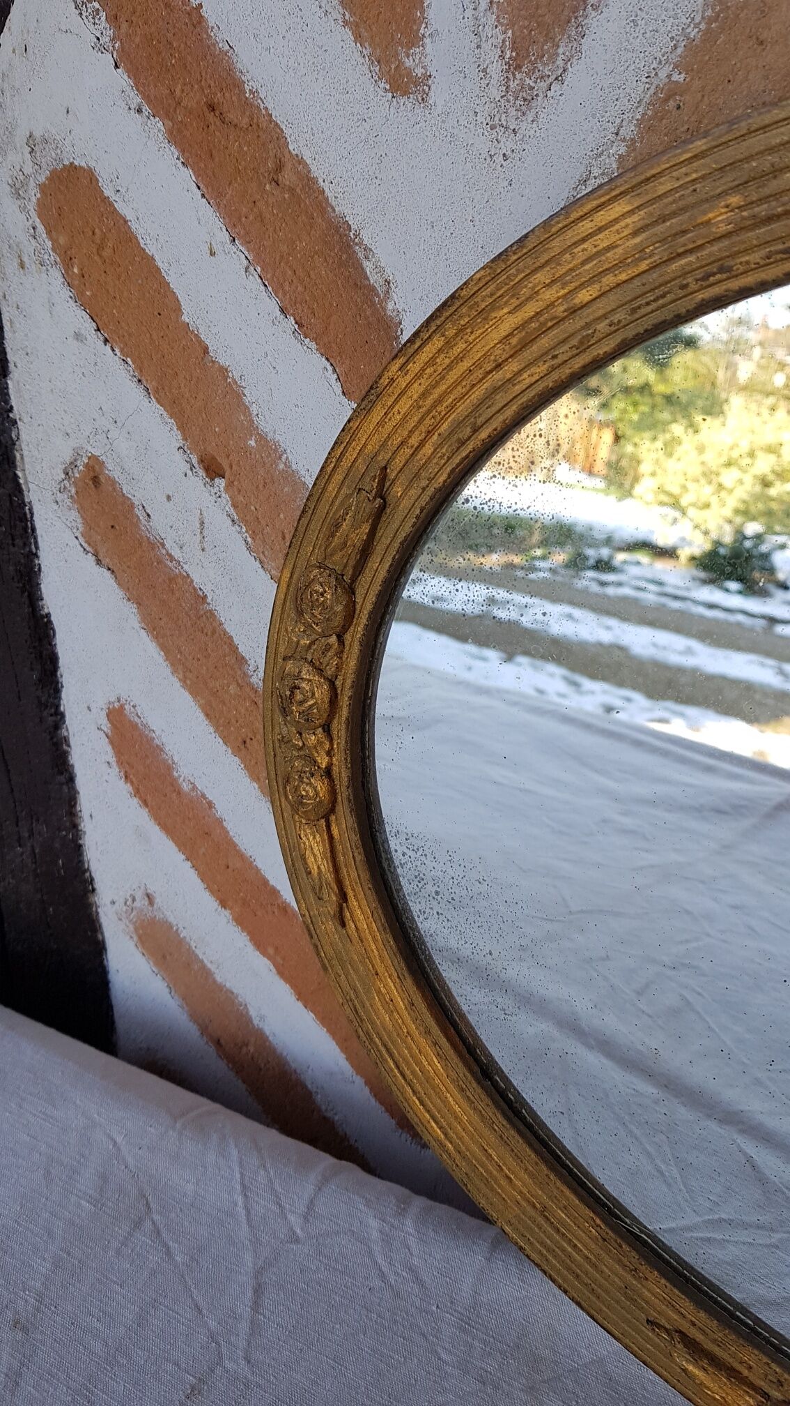 Art Deco golden oval mirror