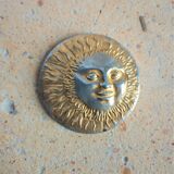 Brass sun paperweight
