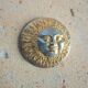 Brass sun paperweight