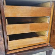 Mid-century mahogany buffet with teal glass and compartments with a drawer.