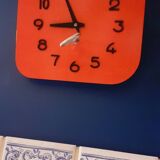Vintage wall clock from the 50s in red formca