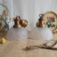 Pair of frosted glass flower pendant lights with vintage wood and brass