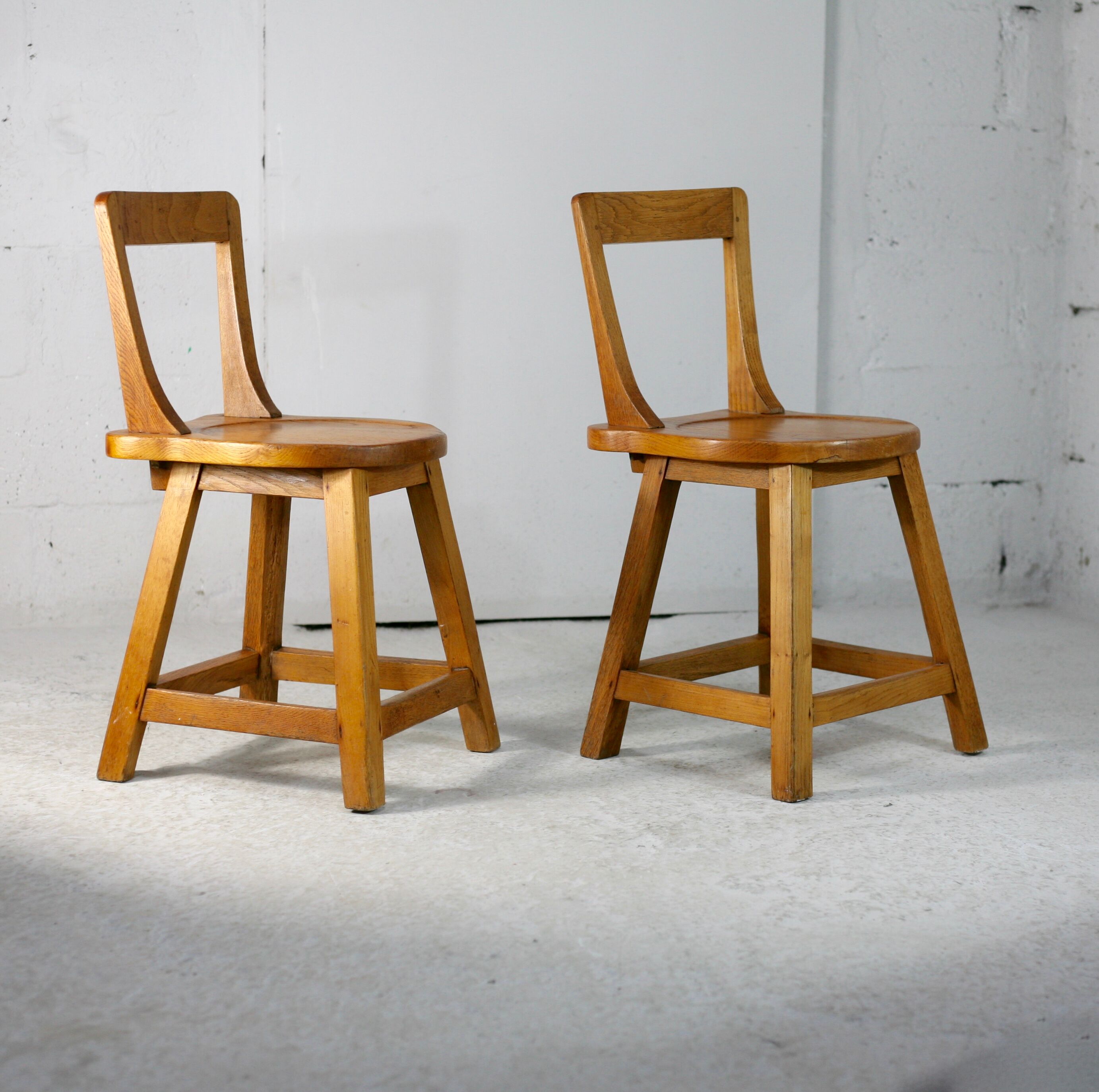 Pair of brutalist wooden back stools. France, circa 1960