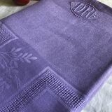 Old damask tablecloth in linen and iris silk