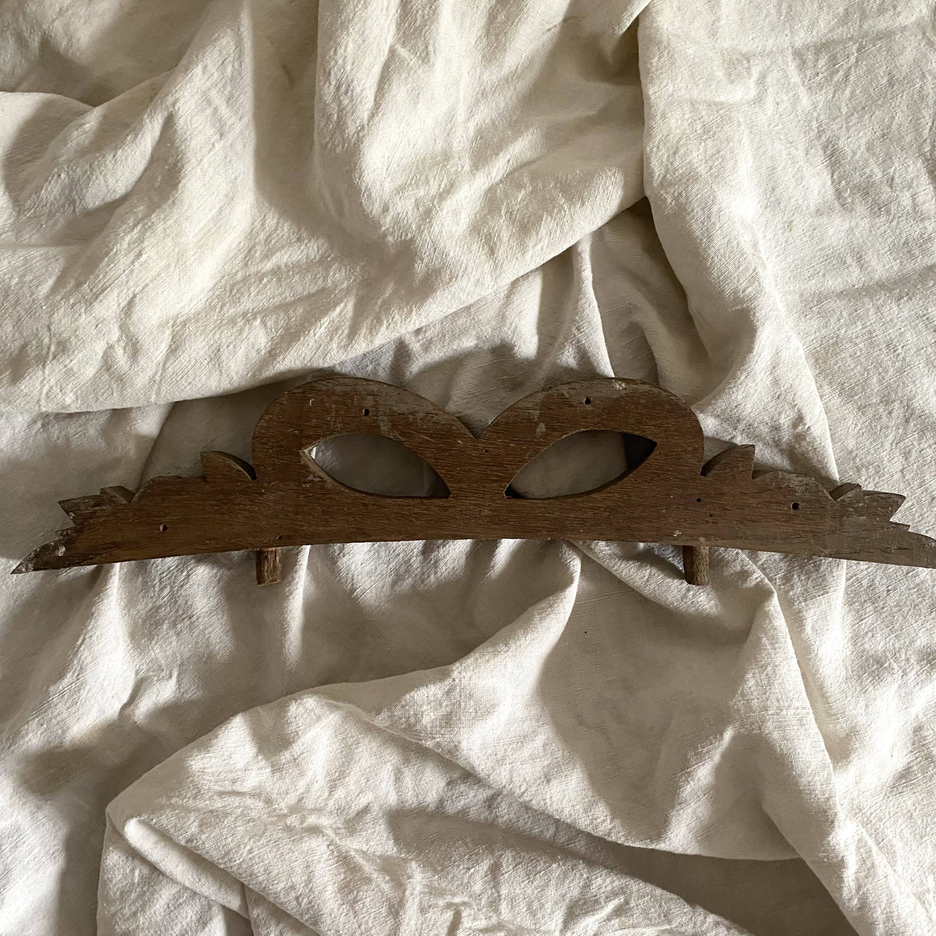 Antique carved wooden ribbon pediment