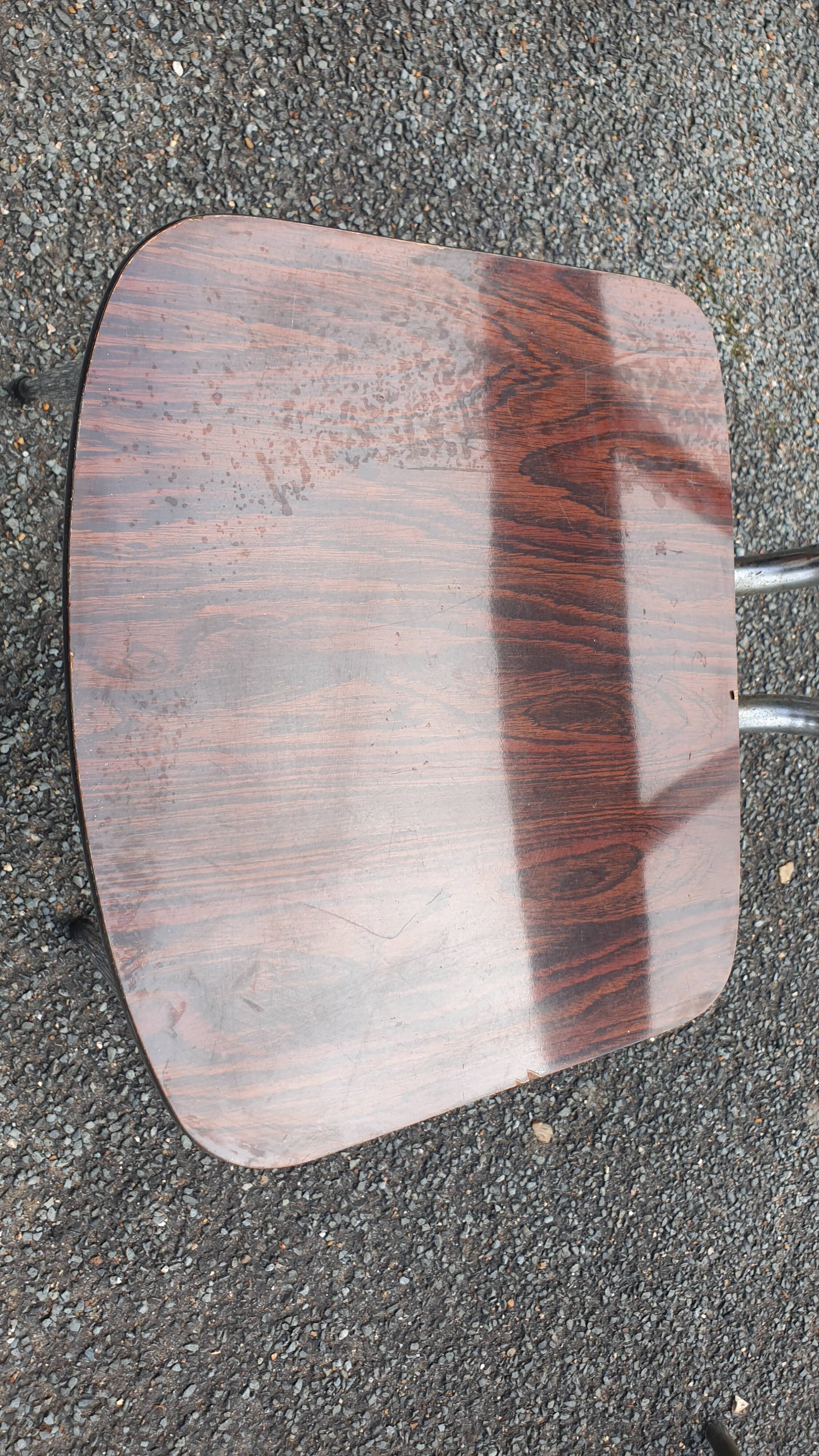 1 veined brown Formica chair