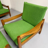 Living room sofa and Scandinavian design armchairs from the 1960s in green boucle.