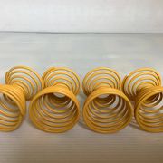 Four yellow spiral spring egg cups