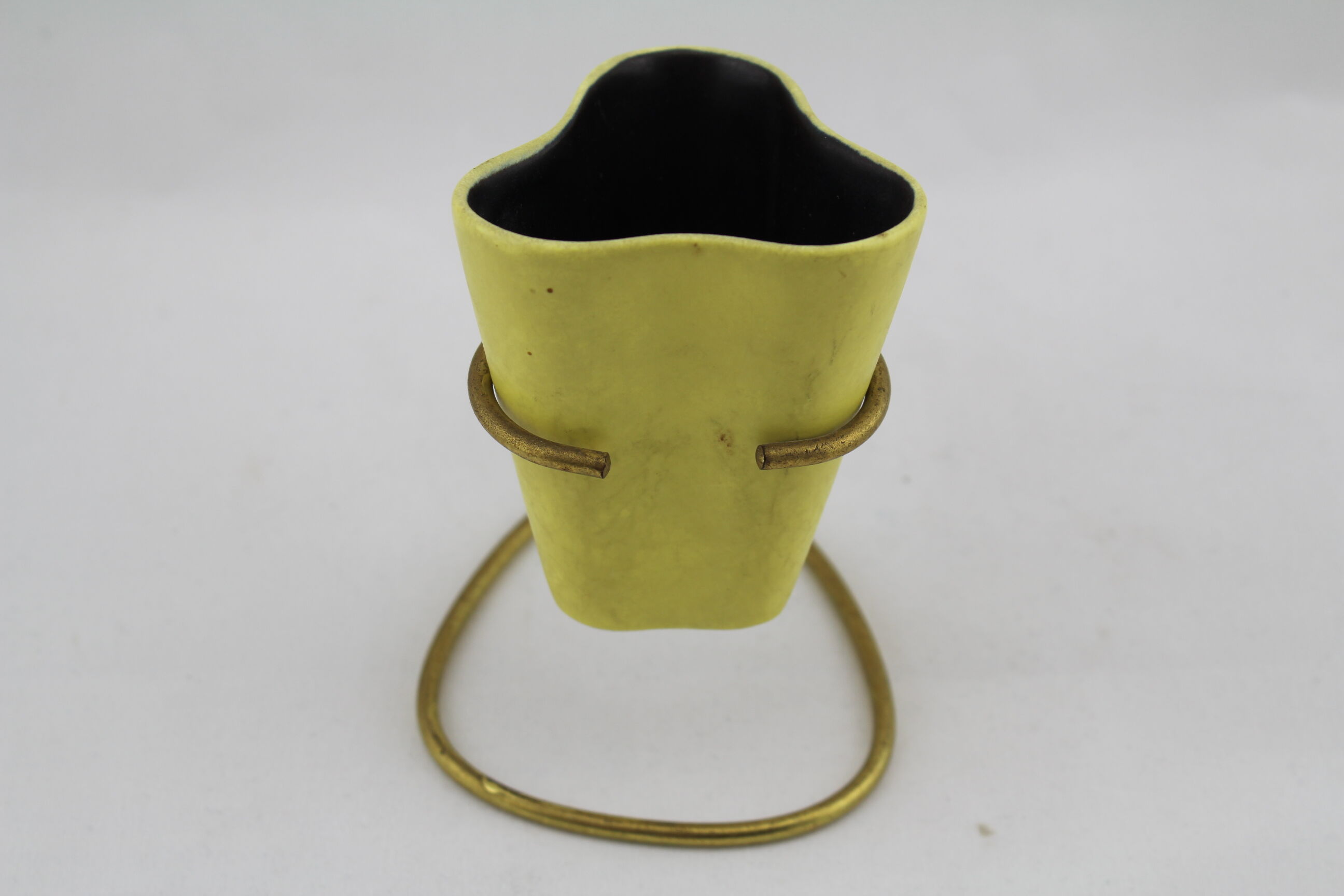 Vase or ceramic pot on foot brass