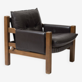 Lounge chair in wood and brown leather producen by TON, Czechoslovakia, 1990s