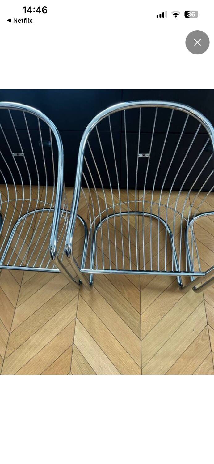 6 chrome metal chairs in the style of Gastonne Ronaldo.