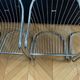 6 chrome metal chairs in the style of Gastonne Ronaldo.
