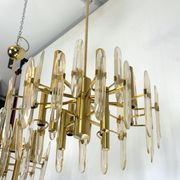 Sciolari, pair of Italian brass and glass chandeliers from 70s