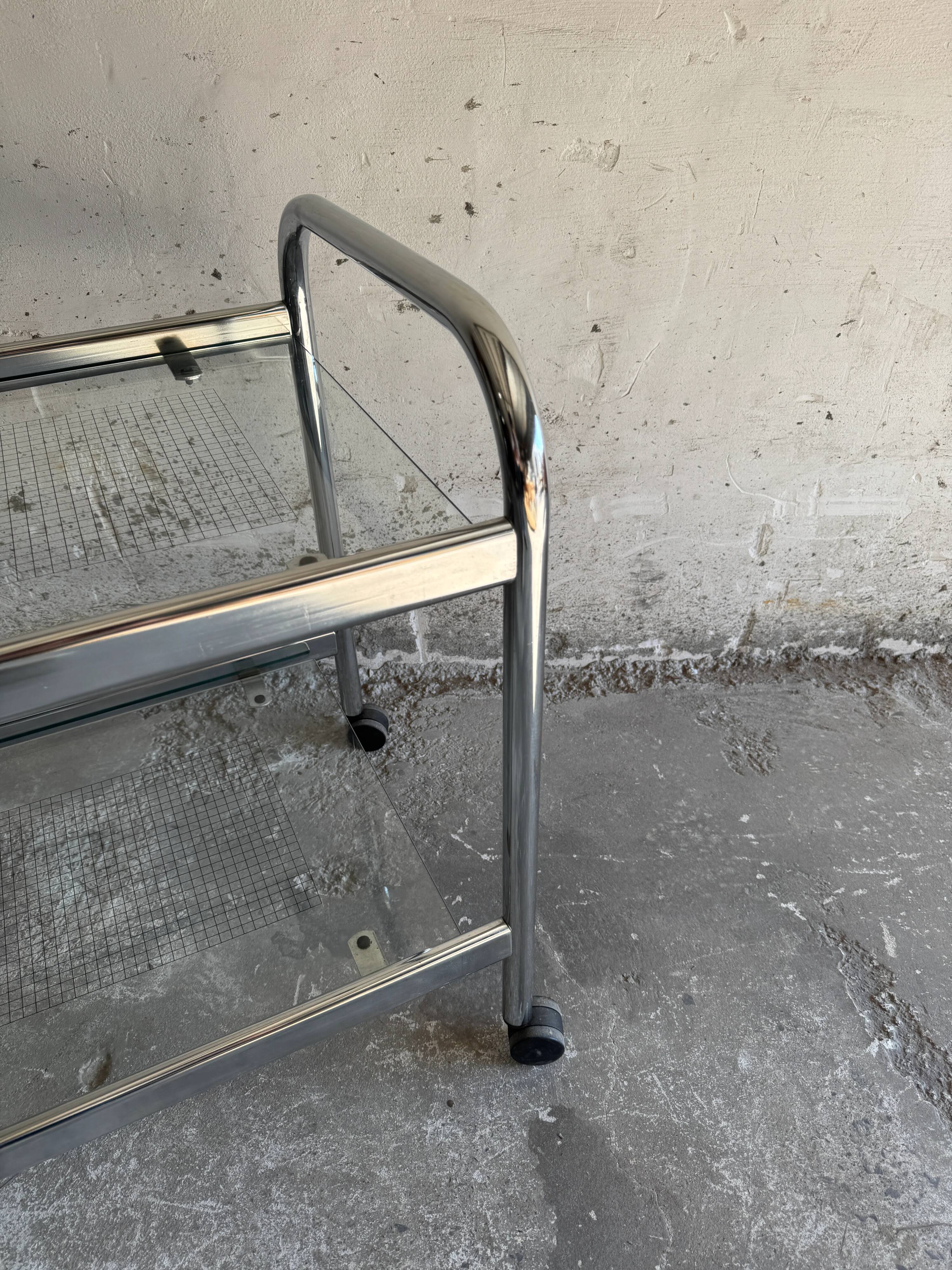 Vintage silver chrome-plated steel and glass two-tier serving trolley with wheels