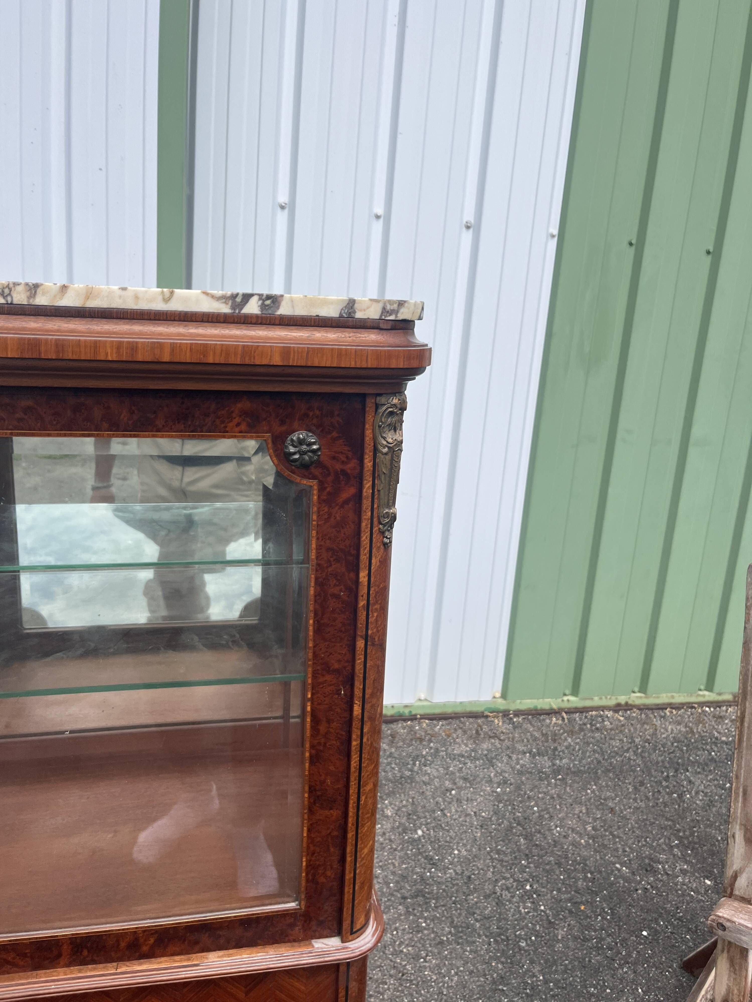 Louis XVI style display cabinet, 19th century, marble and gilded bronzes.