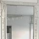 Louis XVI style mirror in wood and carved stucco 20th century