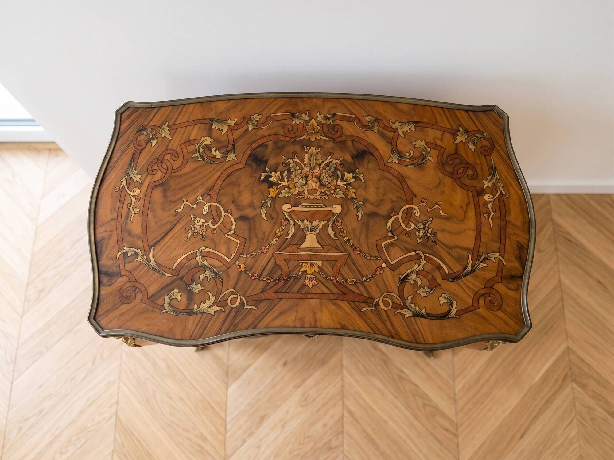 Louis XV console table with marquetry and bronze fittings.