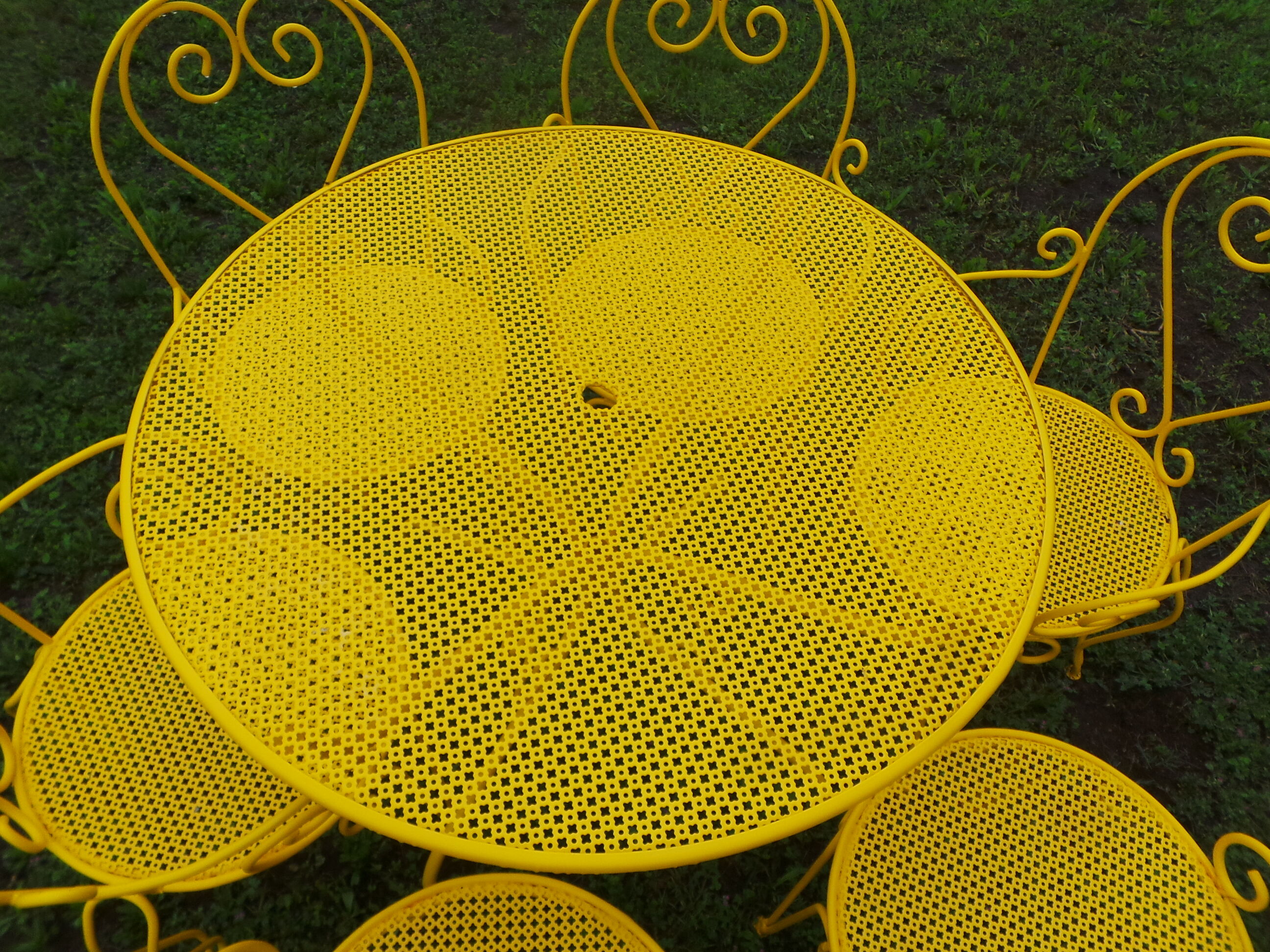 Yellow wrought iron garden room