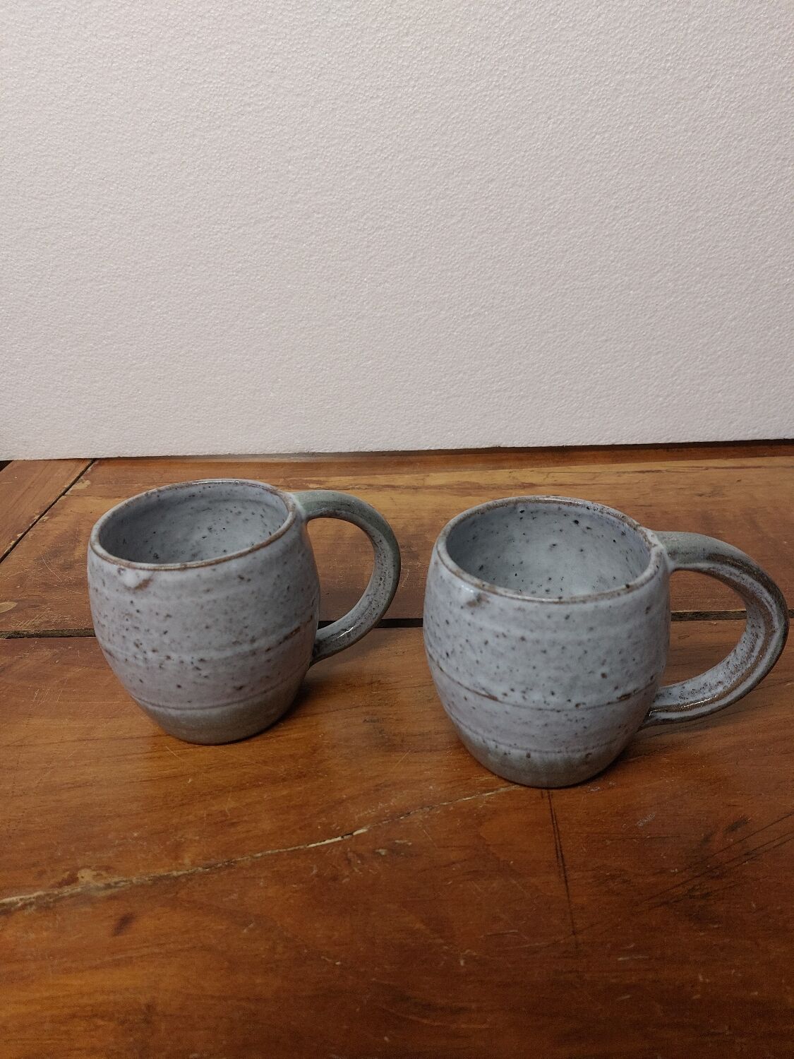 Two glazed stoneware mugs