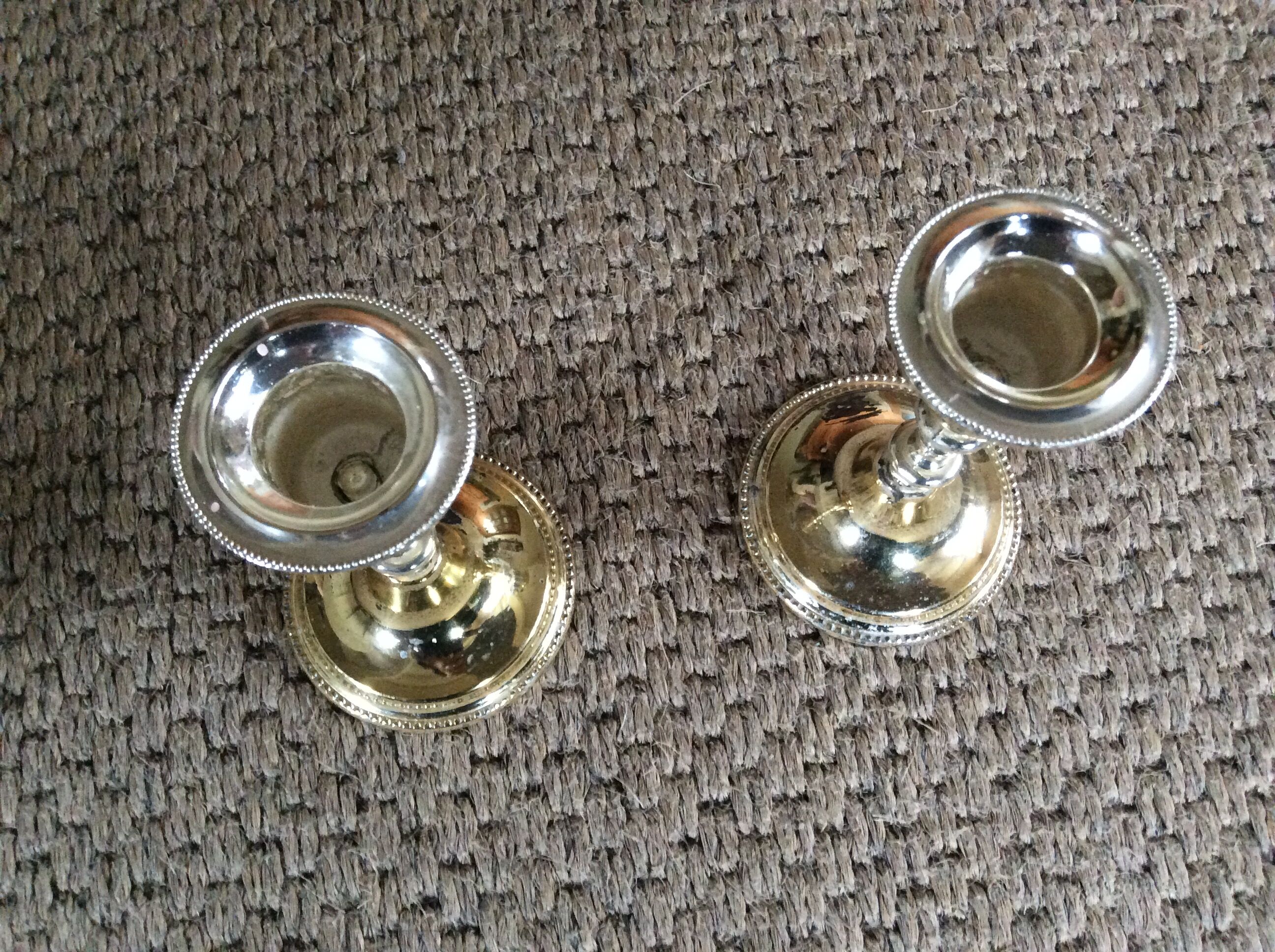 Pair of gold metal candle holders