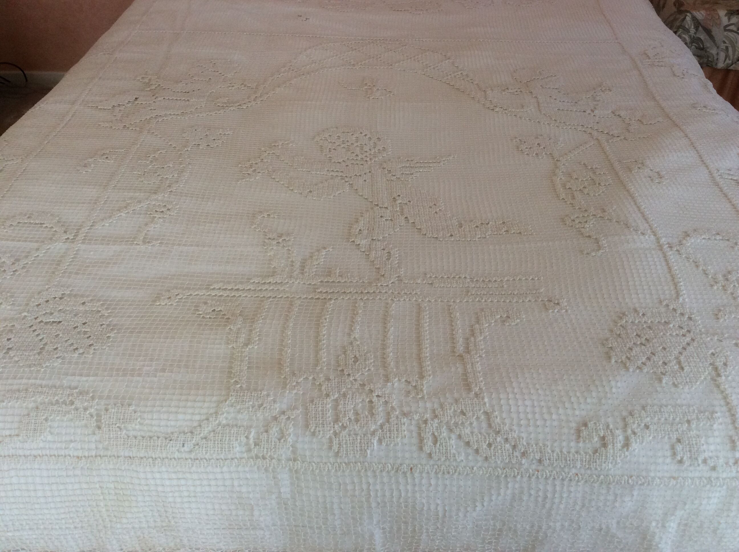 Old bedspread with angel embroidery