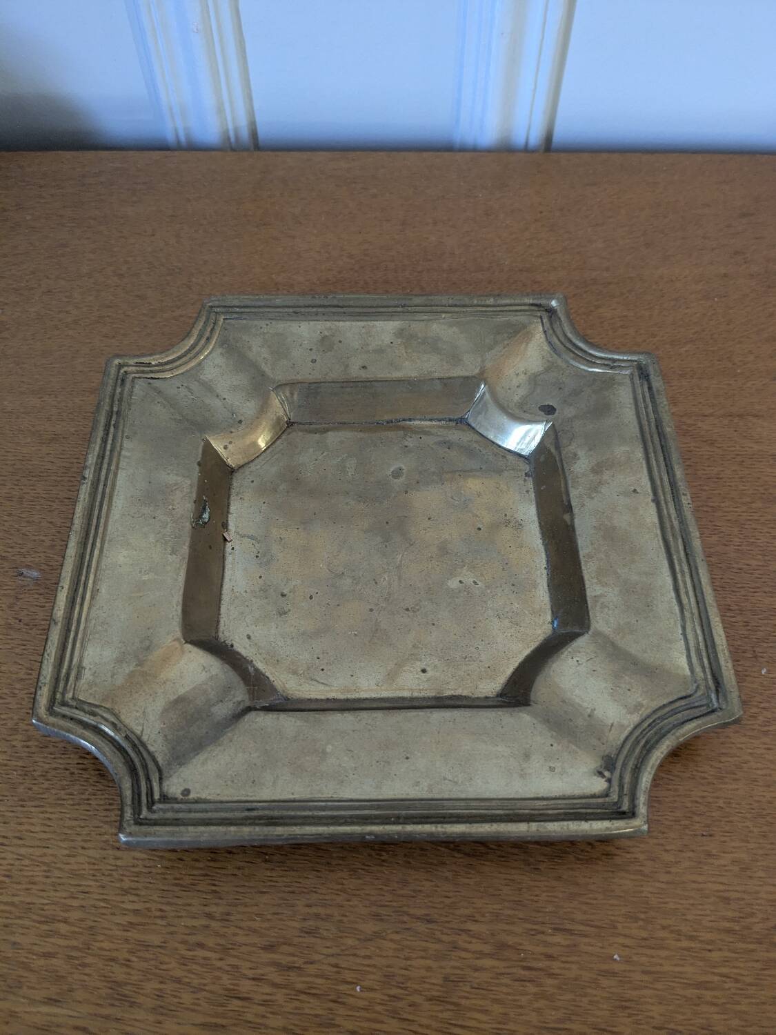 Brass pocket emptier