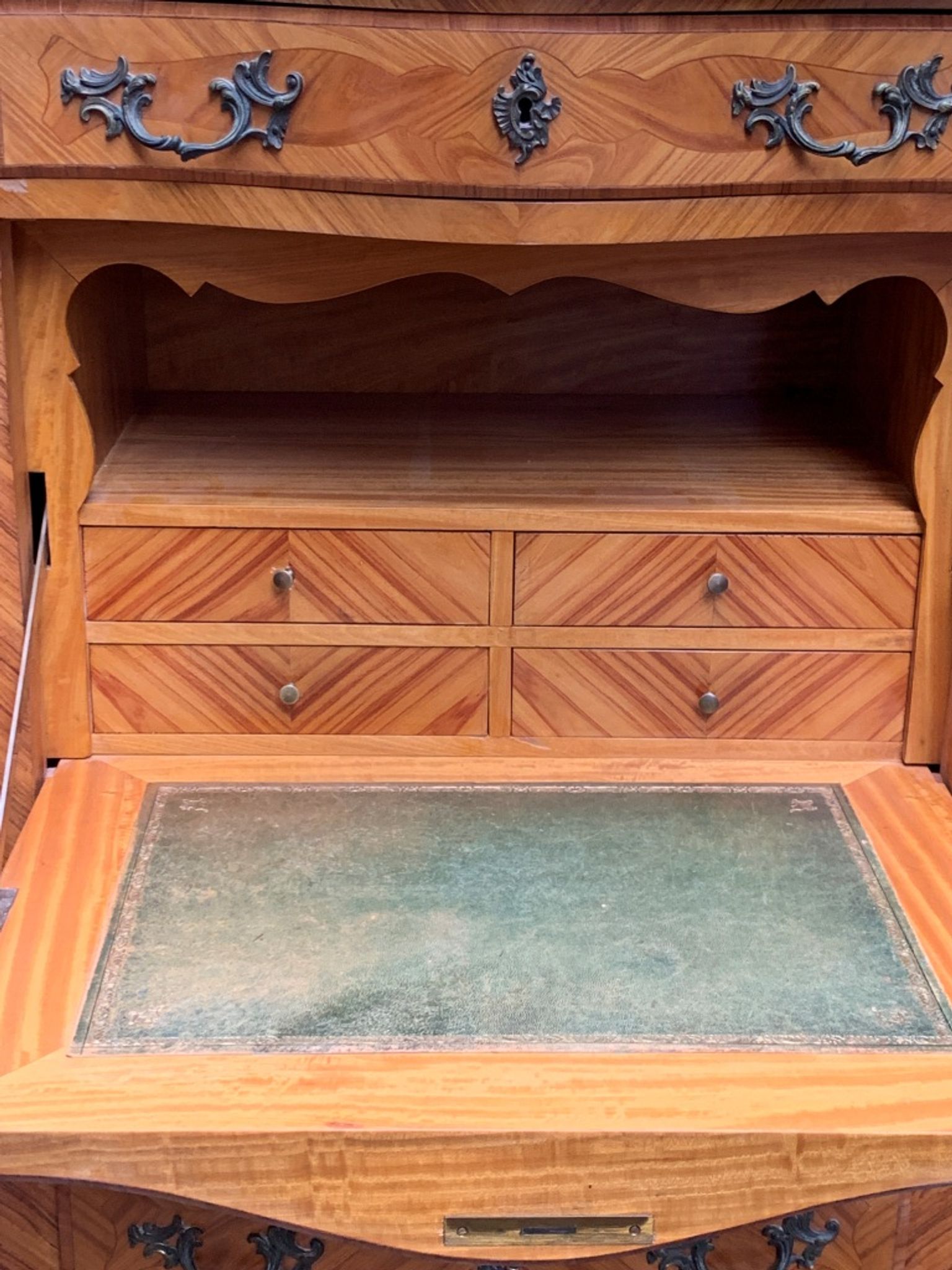 Old French secretary in bronze and wood marquetry.