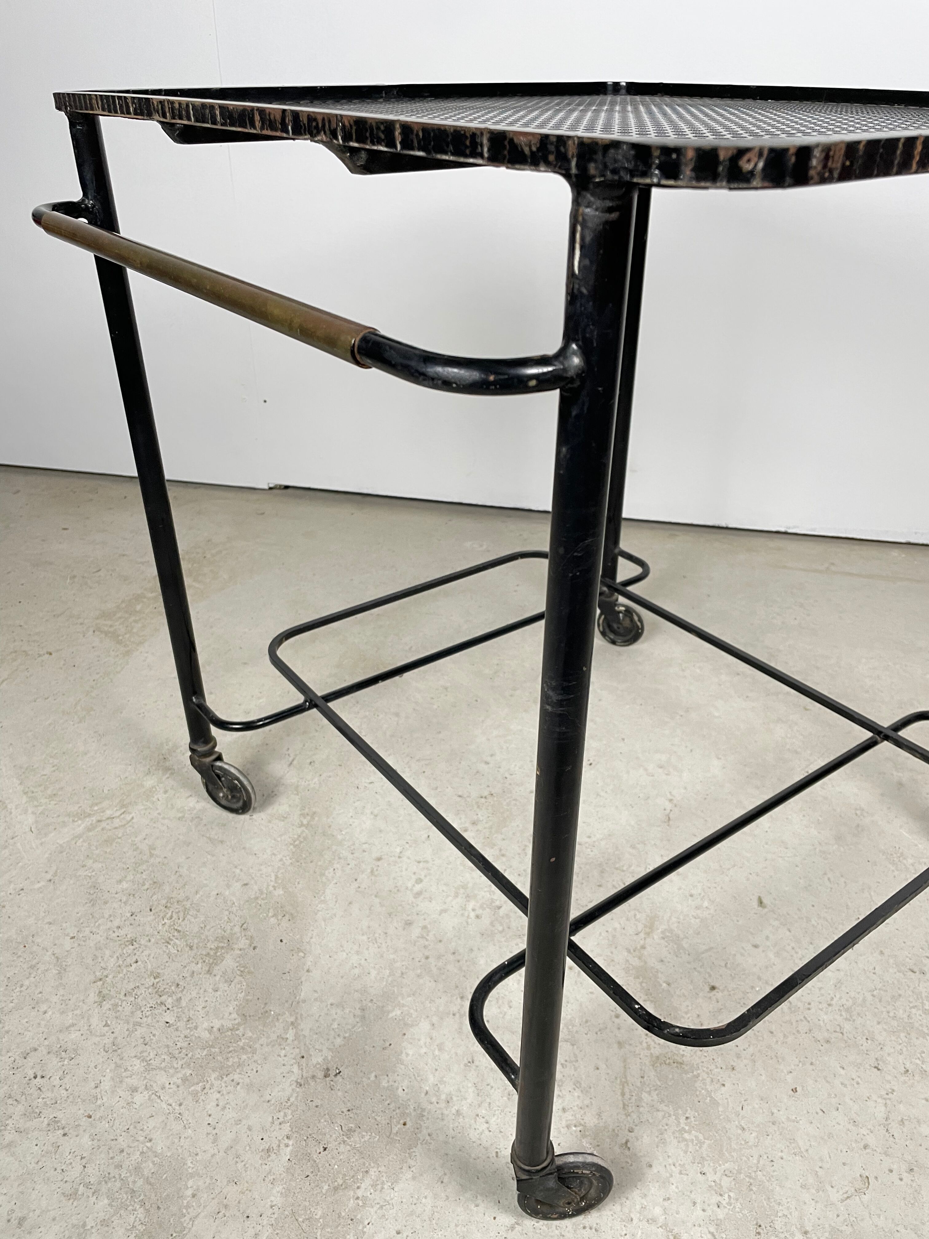 Trolley in perforated sheet metal